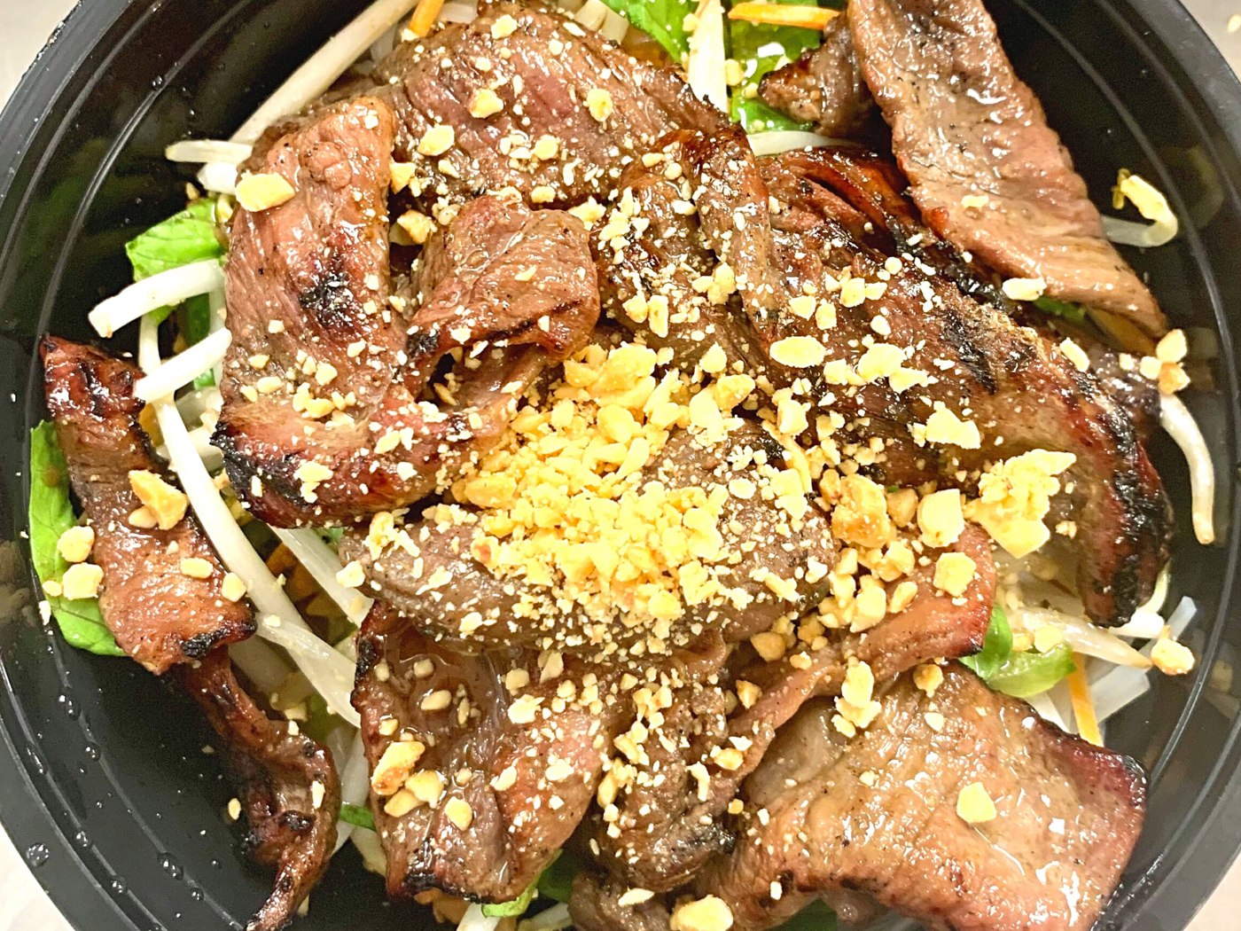 Vietnamese noodle salad with grilled beef, vegetables, and peanuts from Noodle House